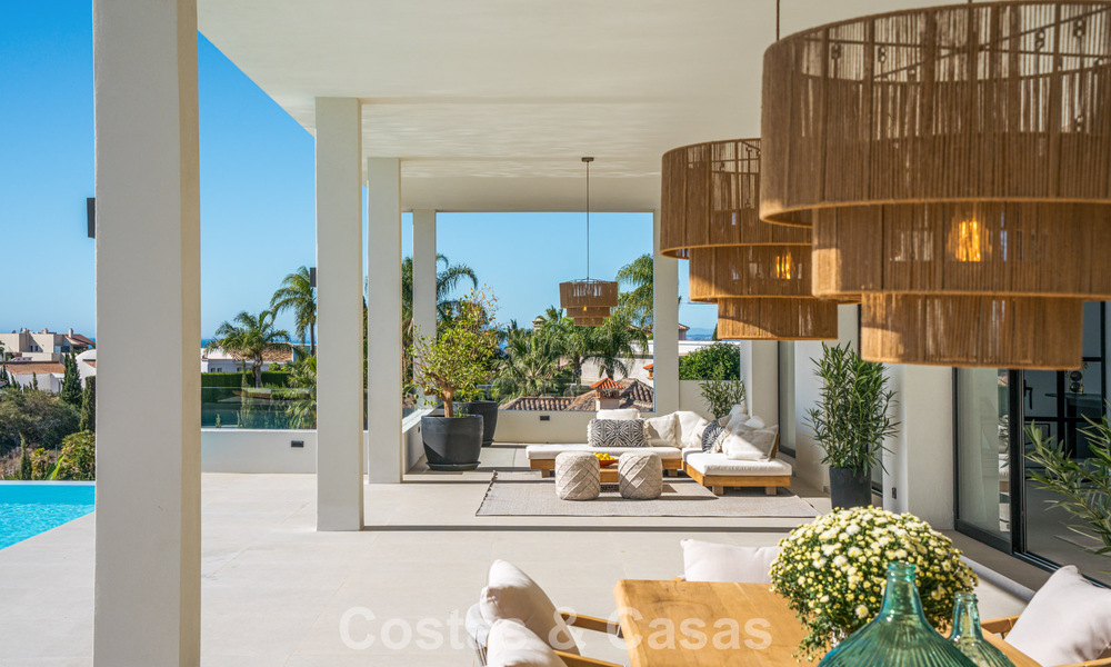 Exclusiva villa de diseño con vistas panorámicas al mar en venta en un resort de golf de cinco estrellas en Marbella - Benahavis 74792